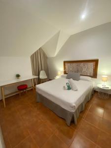 Postel nebo postele na pokoji v ubytování Hotel Doña Matilde