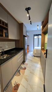 Dapur atau dapur kecil di AP 103 l Com Ar condicionado l Garden l Único