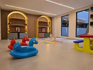 a play room with two rubber ducks and other toys at Beach Haus by Hosppedar in João Pessoa