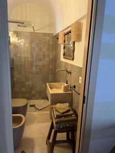 Ванная комната в Dimora Cocchi in Corte +4 фотографии