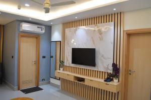 TV a/nebo společenská místnost v ubytování JBR Residency