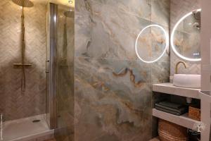 a bathroom with a shower and a sink at De l'élégance au bord de l'eau in La Ciotat +14 photos