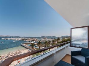 a balcony with a view of the beach and ocean at Formentor in Port de Pollensa