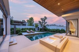 an image of a backyard with a swimming pool at Luxury 3BR Villa Eden with Private Pool by TropicLook in Ban Pak Lak