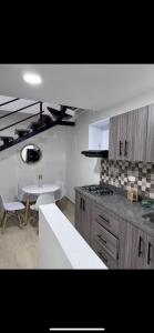 Kuchyň nebo kuchyňský kout v ubytování Apartamento nuevo en Circasia
