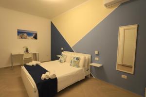 A bed or beds in a room at Casa Onofrio Tropea