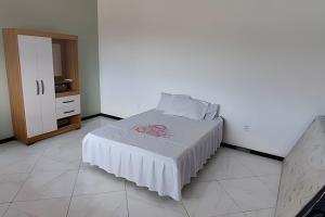 Postel nebo postele na pokoji v ubytování Casa de temporada Guriri com Piscina - Cod 34