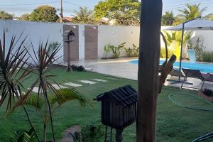 Bazén v ubytování Casa de temporada Guriri com Piscina - Cod 34 nebo v jeho okolí