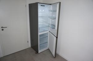 a refrigerator with its door open in a room at Ferienwohnung "Dream Suite" - im Coburger Wonderland - Ihr Zuhause auf Zeit! in Coburg