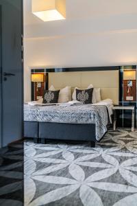Postel nebo postele na pokoji v ubytování ApartHotel Tatry de Luxe FizjoMedical & Spa