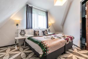 Postel nebo postele na pokoji v ubytování ApartHotel Tatry de Luxe FizjoMedical & Spa