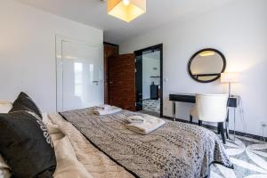 Postel nebo postele na pokoji v ubytování ApartHotel Tatry de Luxe FizjoMedical & Spa