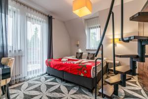 Postel nebo postele na pokoji v ubytování ApartHotel Tatry de Luxe FizjoMedical & Spa