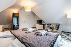 Postel nebo postele na pokoji v ubytování ApartHotel Tatry de Luxe FizjoMedical & Spa