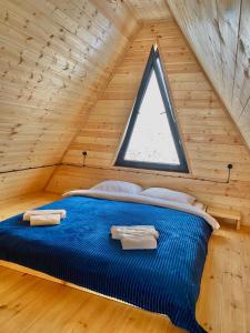 Postel nebo postele na pokoji v ubytování Aura Gudauri + 2 fotografie