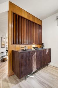 a kitchen with wood paneled walls in a room at Boulder Bungalow in Prescott