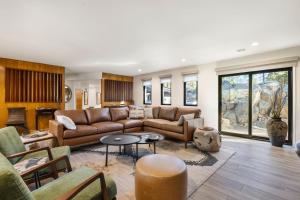 a living room with a couch and a table at Boulder Bungalow in Prescott