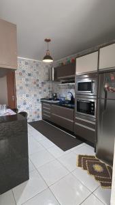 Η κουζίνα ή μικρή κουζίνα στο Cantinho da jana +9 φωτογραφίες