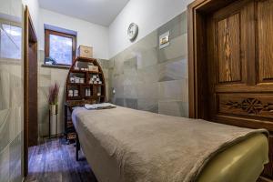 Postel nebo postele na pokoji v ubytování ApartHotel Tatry de Luxe FizjoMedical & Spa