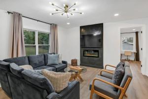 a living room with a couch and a table at Earlewood Ranch - 4BR, 3BA in Columbia