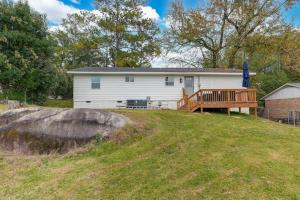 a house on a hill with a deck and an umbrella at Earlewood Ranch - 4BR, 3BA in Columbia