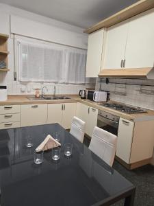 a kitchen with a table with wine glasses on it at MMM HOME Train Station 3 in Mestre +48 photos