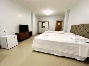 Postel nebo postele na pokoji v ubytování Danny's Hotel