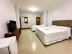 Postel nebo postele na pokoji v ubytování Danny's Hotel