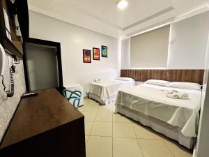 Postel nebo postele na pokoji v ubytování Danny's Hotel