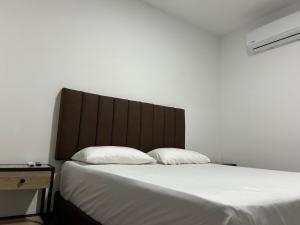 Postel nebo postele na pokoji v ubytování Hotel Gallery By 70