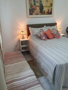 Ένα ή περισσότερα κρεβάτια σε δωμάτιο στο Quarto & Conforto