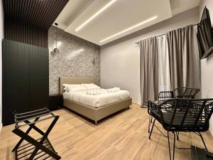 Eterna Suites Roma客房内的一张或多张床位