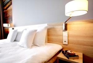 Posteľ alebo postele v izbe v ubytovaní Park Hotel & Restauracja Browar Brzeg