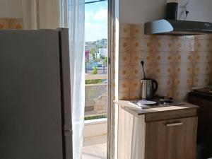 A kitchen or kitchenette at Amazing Sea View, Rafina Port, Athens Airport, Self-Check-in
