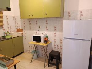A kitchen or kitchenette at Amazing Sea View, Rafina Port, Athens Airport, Self-Check-in