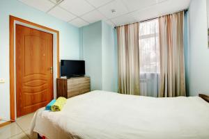 Säng eller sängar i ett rum på Brusnika Hotel Nagornaya