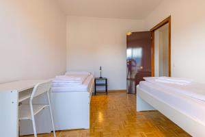 Letto o letti in una camera di Imperial of Lugano 4 with a lake view behind the station and 10 min from the lake