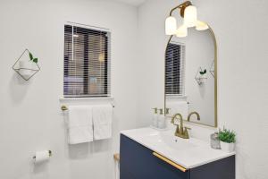 a bathroom with a sink and a mirror at Yosemite Forest Villa in Oakhurst +100 photos