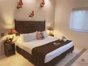 Postel nebo postele na pokoji v ubytování Villas Palmar Holbox