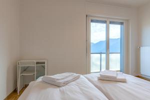 Letto o letti in una camera di Imperial of Lugano 4 with a lake view behind the station and 10 min from the lake