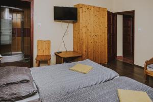 Posteľ alebo postele v izbe v ubytovaní Balázs vendégház
