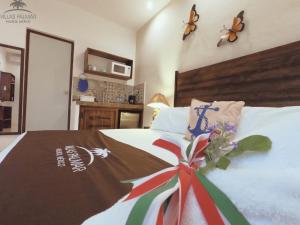 Postel nebo postele na pokoji v ubytování Villas Palmar Holbox