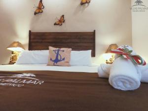 Postel nebo postele na pokoji v ubytování Villas Palmar Holbox