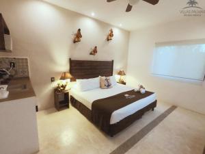 Postel nebo postele na pokoji v ubytování Villas Palmar Holbox
