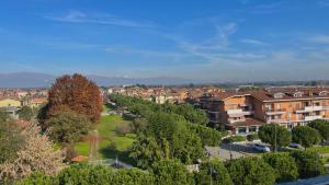 a town with houses and trees in a city at G house in Leinì