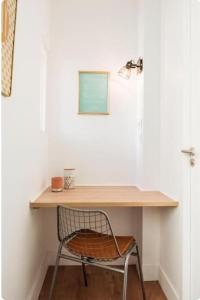 a chair sitting at a desk in a room at Bancel- Jean Macé in Lyon