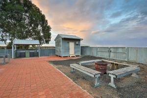 a patio with two benches and a small building at Mungo Shearers' Quarters in Mungo +8 photos