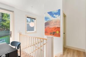 a white room with a staircase and a window at Chic 1BR DADU in Queen Anne in Seattle