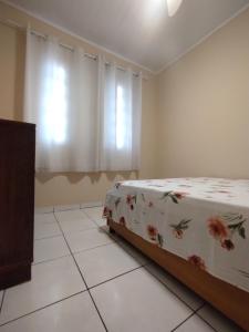 Giường trong phòng chung tại Casa de praia para temporada espaço inteiro Putiri ES