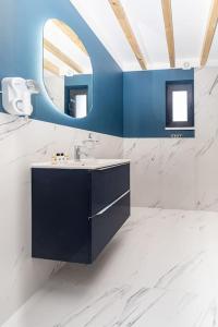 a bathroom with a sink and a mirror at TOP house with private HOT TUB-near sea, lakes and forest in Kołczewo